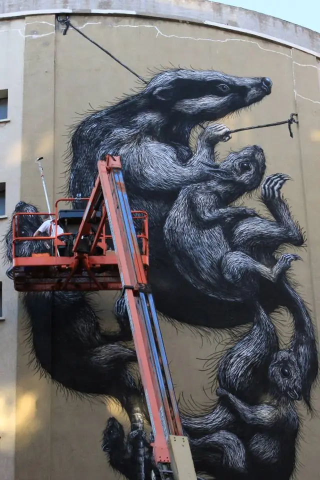 The animal mural and lift seen from a close angle during painting